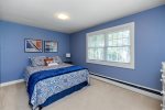 Spacious upstairs bedroom with cozy Queen bed