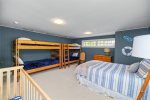 Large upstairs bedroom with a queen, 2 twin bunk beds and a crib