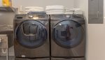 Large capacity washer and dryer in the basement laundry room 