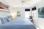 Queen bedroom with smart TV on the main floor of the home