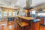 Fully equipped kitchen with seating at the bar