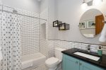 Beautiful tile in this full bathroom with tub in the main house