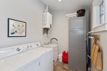 Large washer and dryer at the rear of the main house