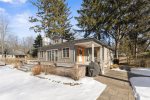 Enjoy some time on the spacious front porch of the main house