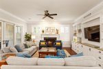 Comfy seating, open layout, and warm natural light make this living area a welcoming retreat.