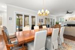 Large dining room table with views of screened porch and pool