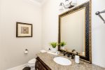 A stylish and functional half bathroom located on the first floor, perfect for guests and everyday use.