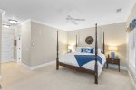 The primary bedroom features a luxurious king bed, offering a spacious and comfortable retreat for ultimate relaxation.