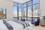 Primary bedroom with king bed and gorgeous lake views