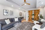 First floor living room with cozy seating and TV 