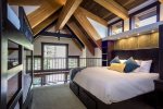 The second floor bedroom offers an additional king bed and twin over twin bunk beds.