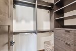 The primary suite walk-in closet offers plenty of space to unpack and settle in.