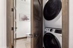 Adjacent to the main living space, the home offers in-unit washer and dryer.