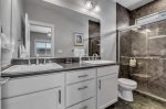Amazing double sinks and a large walk in shower. Bathroom comes fully stocked with plenty of linens for your stay. 