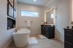Master ensuite bathroom with a large soaking tub & huge walk in shower with double heads 