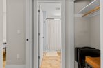 Small hall closet outside Bedroom & Bathroom 1 