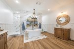 Walk throuhg shower, tub and double lavatories