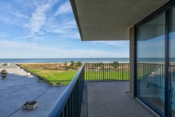 Great ocean and pool views from the wrap around balcony of this Sea Colony condo! 