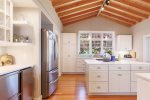 Large Kitchen with beautiful granite countertops, steel appliances, and large island