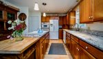 A butcher block end island with stool is a favorite for kids to hang out at or the partner who likes to bend your ear about Sally at work. Enjoy our kitchen that is open and easy to work in