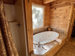 Main Floor Bathroom with jetted tub and stand up shower